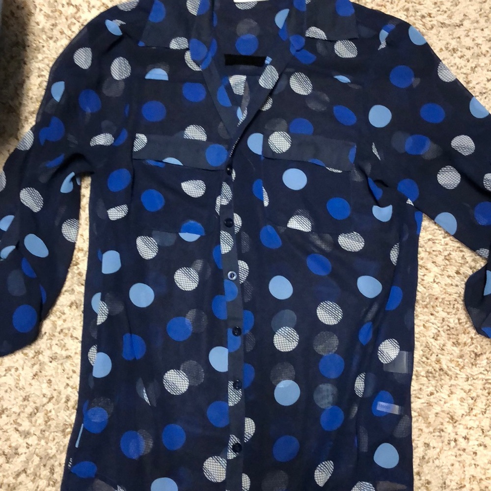 Sheer blue polka dot blouse.